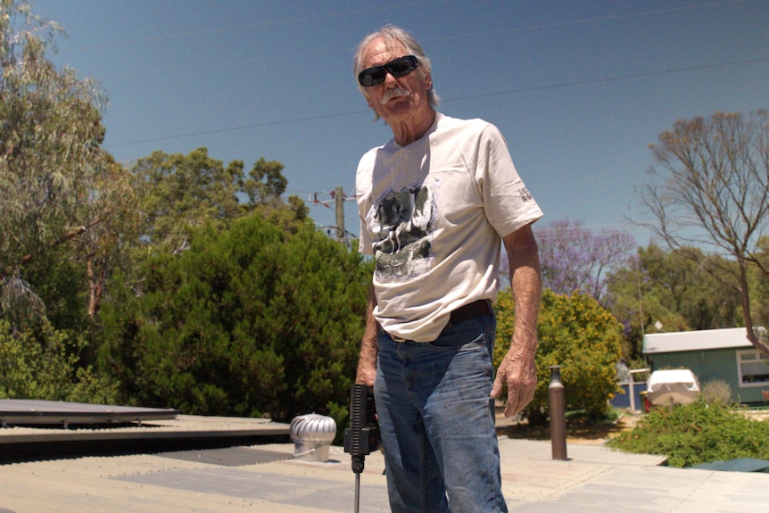 A photo of Greenbushes resident Rick Fryer sitting at home.