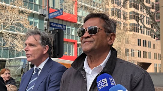 Former AFL player Nicky Winmar has been accused of dragging a woman by her hair.