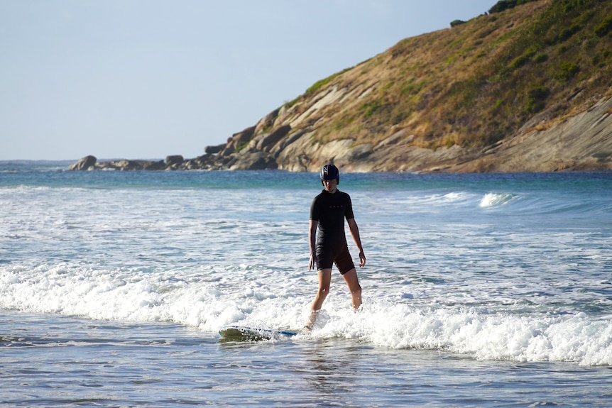 Max Forster-Ross rides a wave to shore. 