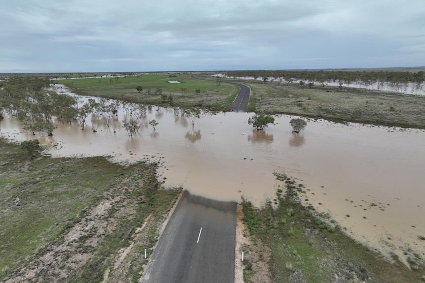 outback road with stretch of water across it