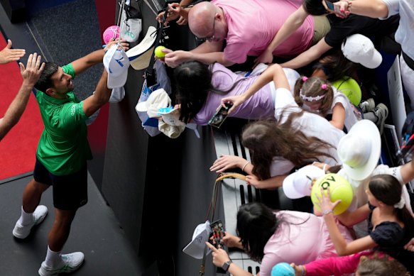 Novak Djokovic signs autographs on Wednesday.