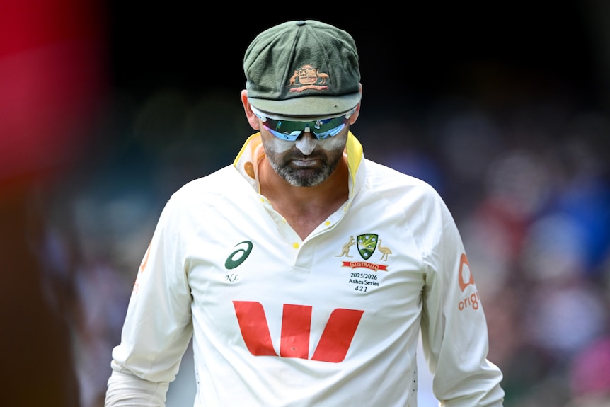 Nathan Lyon looks down