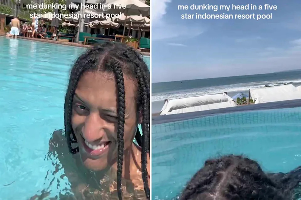 Josh films himself swimming and dunking his head underwater at the resort pool in Bali