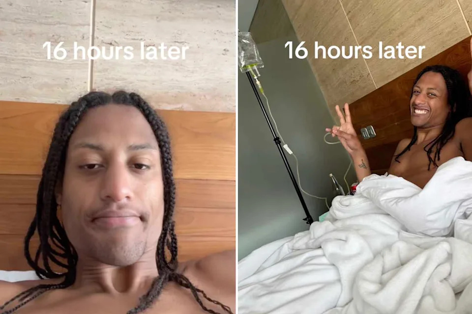 Josh sits in his hotel bed, smiling and giving a peace sign to the camera while a drip is connected to his arm