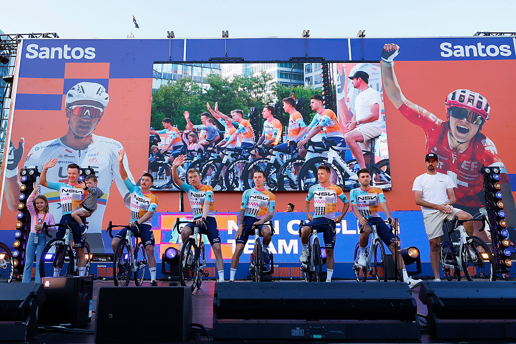 ADELAIDE, AUSTRALIA - JANUARY 16: A general view of Simon Clarke of Australia, Brady Gilmore of Australia, Nick Schultz of Australia, Jake Stewart of Great Britain, Corbin Strong of New Zealand, Ethan Vernon of Great Britain and NSN Cycling Team during the 26th Santos Tour Down Under 2026, Team Presentation on January 16, 2026 in Adelaide, Australia. (Photo by Con Chronis/Getty Images)