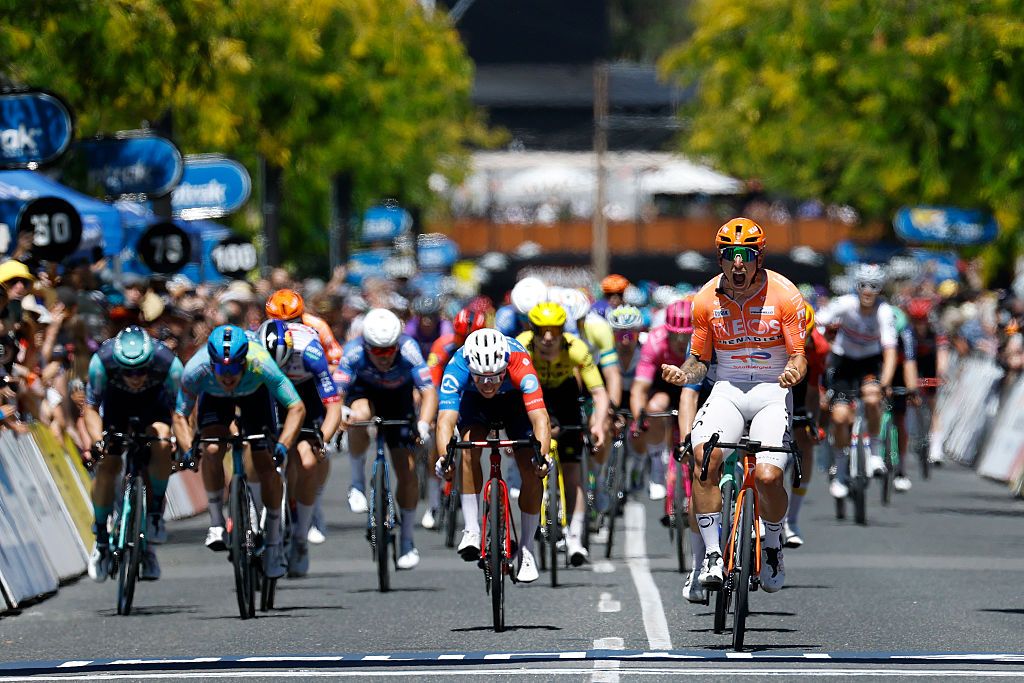 NAIRNE, AUSTRALIA - JANUARY 23: Sam Welsford of Australia and Team INEOS Grenadiers (R) celebrates at finish line as stage winner ahead of (L-R) Aaron Gate of New Zealand and XDS Astana Team and Lewis Bower of New Zealand and Team Groupama - FDJ United during the 26th Santos Tour Down Under 2026, Stage 3 a 140.8km stage from Henley Beach to Nairne / #UCIWT / on January 23, 2026 in Nairne, Australia. (Photo by Con Chronis/Getty Images)