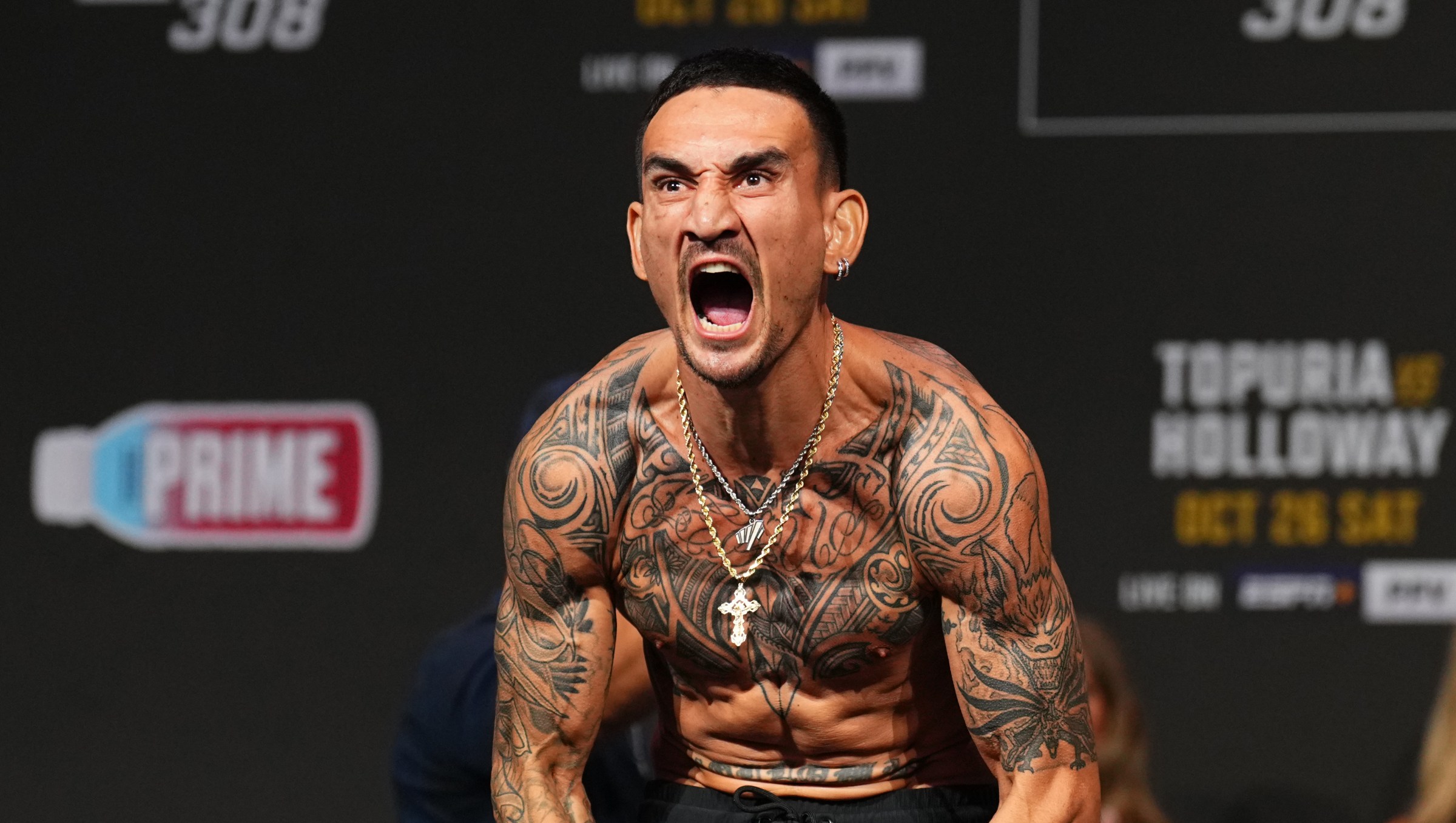 ABU DHABI, UNITED ARAB EMIRATES - OCTOBER 25: Max Holloway poses on the scale during the UFC 308 ceremonial weigh-in at Etihad Arena on October 25, 2024 in Abu Dhabi, United Arab Emirates. (Photo by Chris Unger/Zuffa LLC)