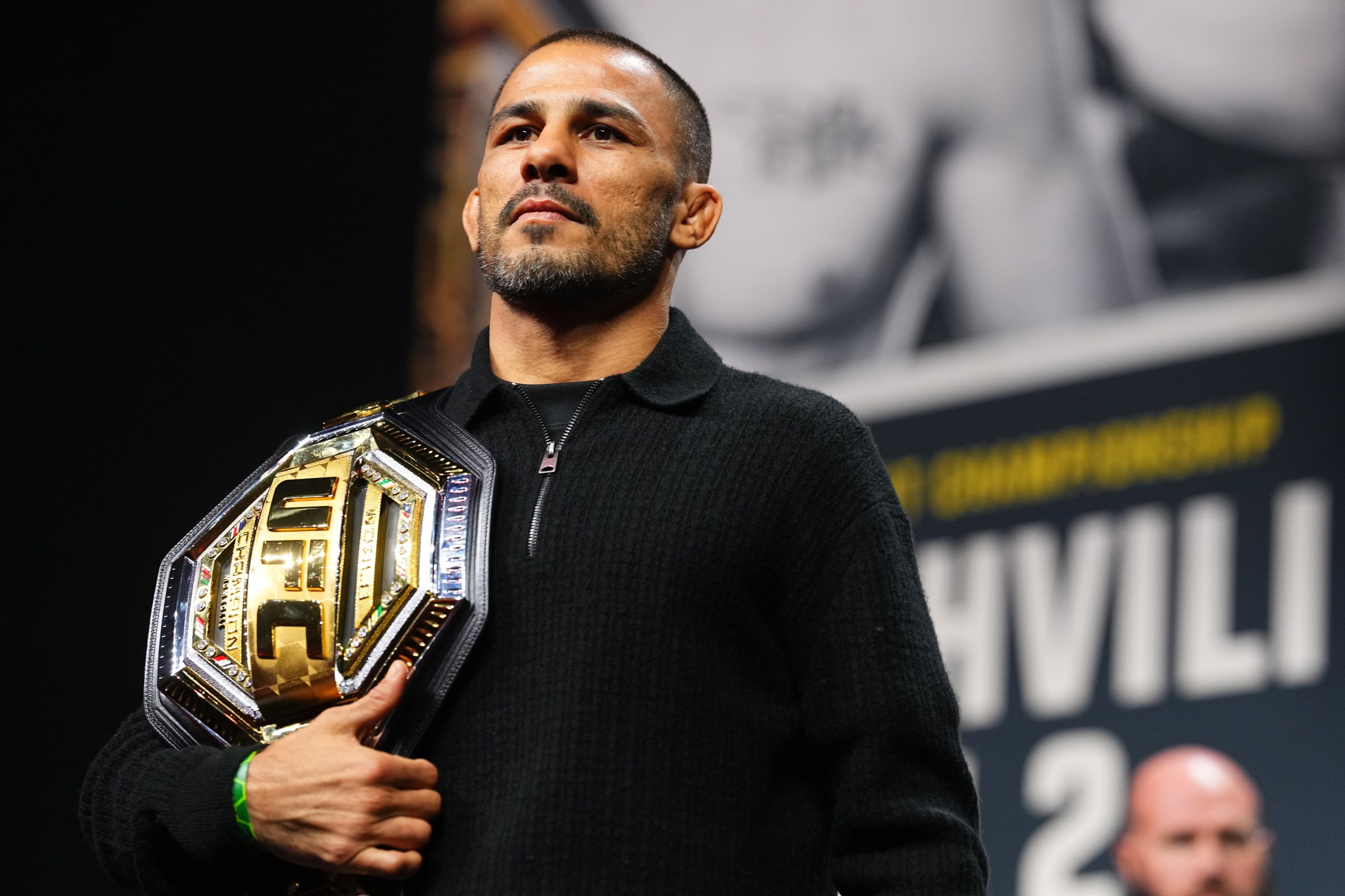 LAS VEGAS, NEVADA - DECEMBER 04: Alexandre Pantoja of Brazil is seen on stage during the UFC 323 press conference at T-Mobile Arena on December 04, 2025 in Las Vegas, Nevada. (Photo by Chris Unger/Zuffa LLC)