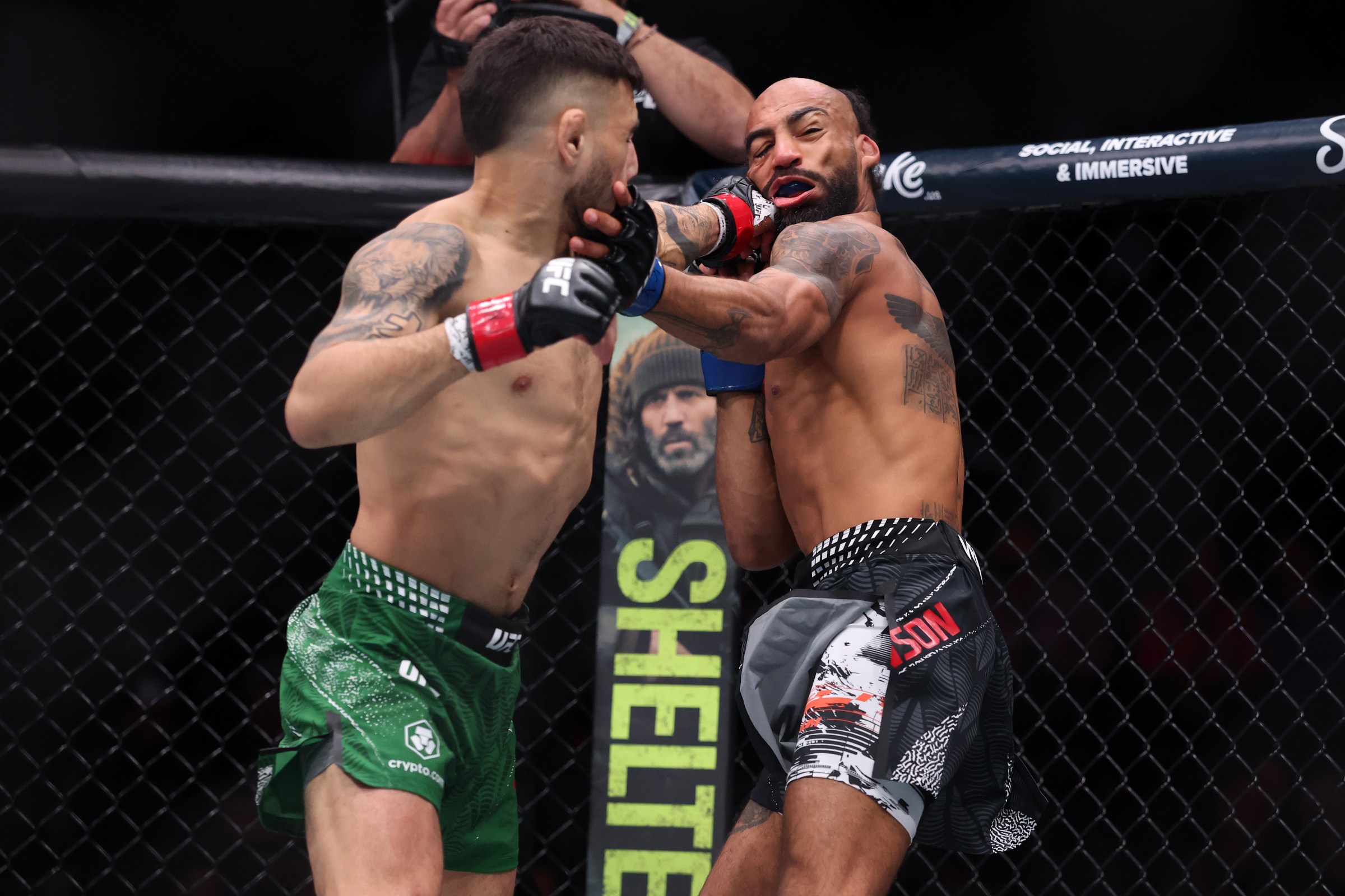LAS VEGAS, NEVADA - JANUARY 24: (L-R) Alex Perez strikes Charles Johnson during the UFC 324 event at T-Mobile Arena on January 24, 2026 in Las Vegas, Nevada. (Photo by Ed Mulholland/Zuffa LLC)