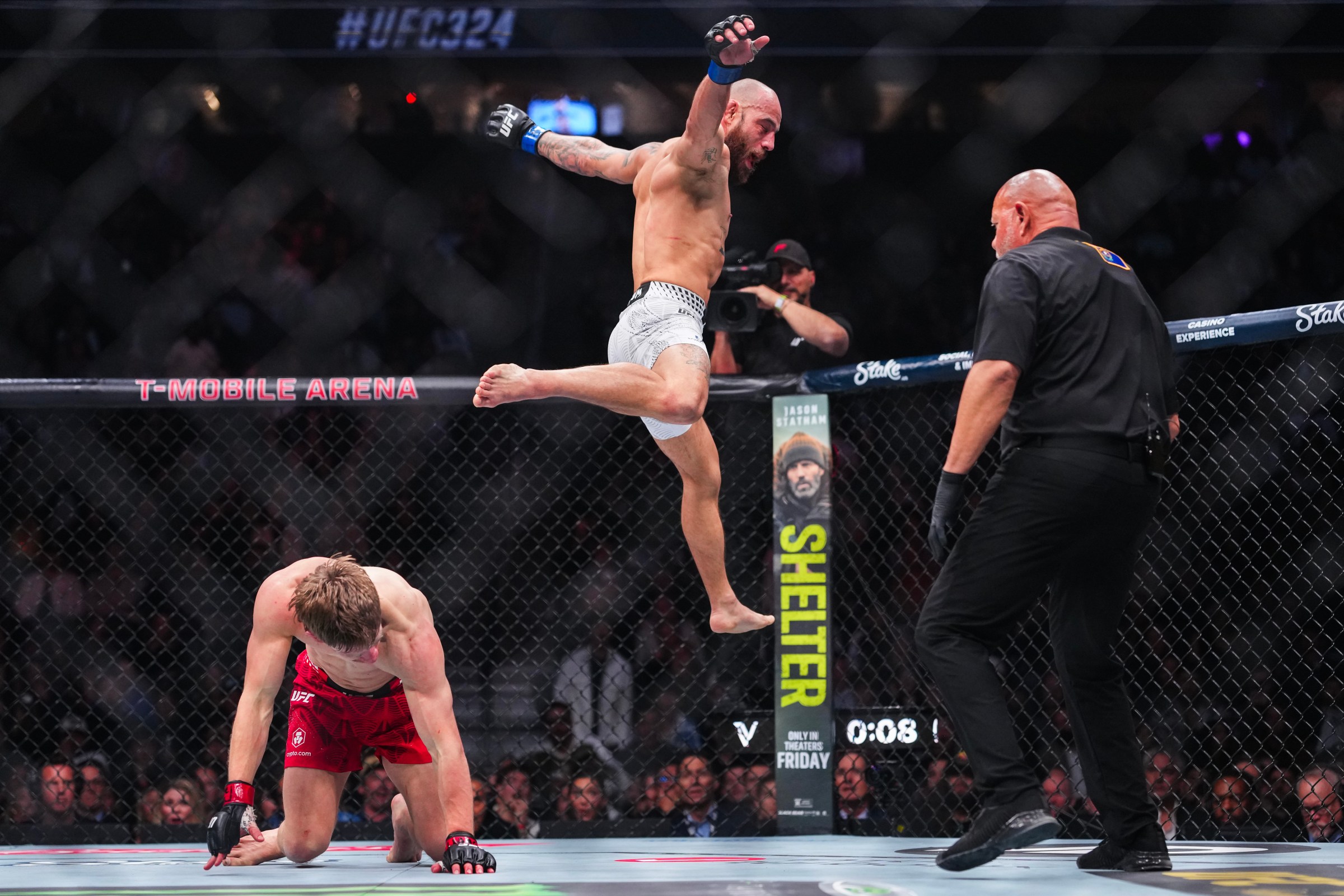 LAS VEGAS, NEVADA - JANUARY 24: Jean Silva of Brazil jumps off the back of Arnold Allen of England in a featherweight bout during the UFC 324 event at T-Mobile Arena on January 24, 2026 in Las Vegas, Nevada. (Photo by Cooper Neill/Zuffa LLC)