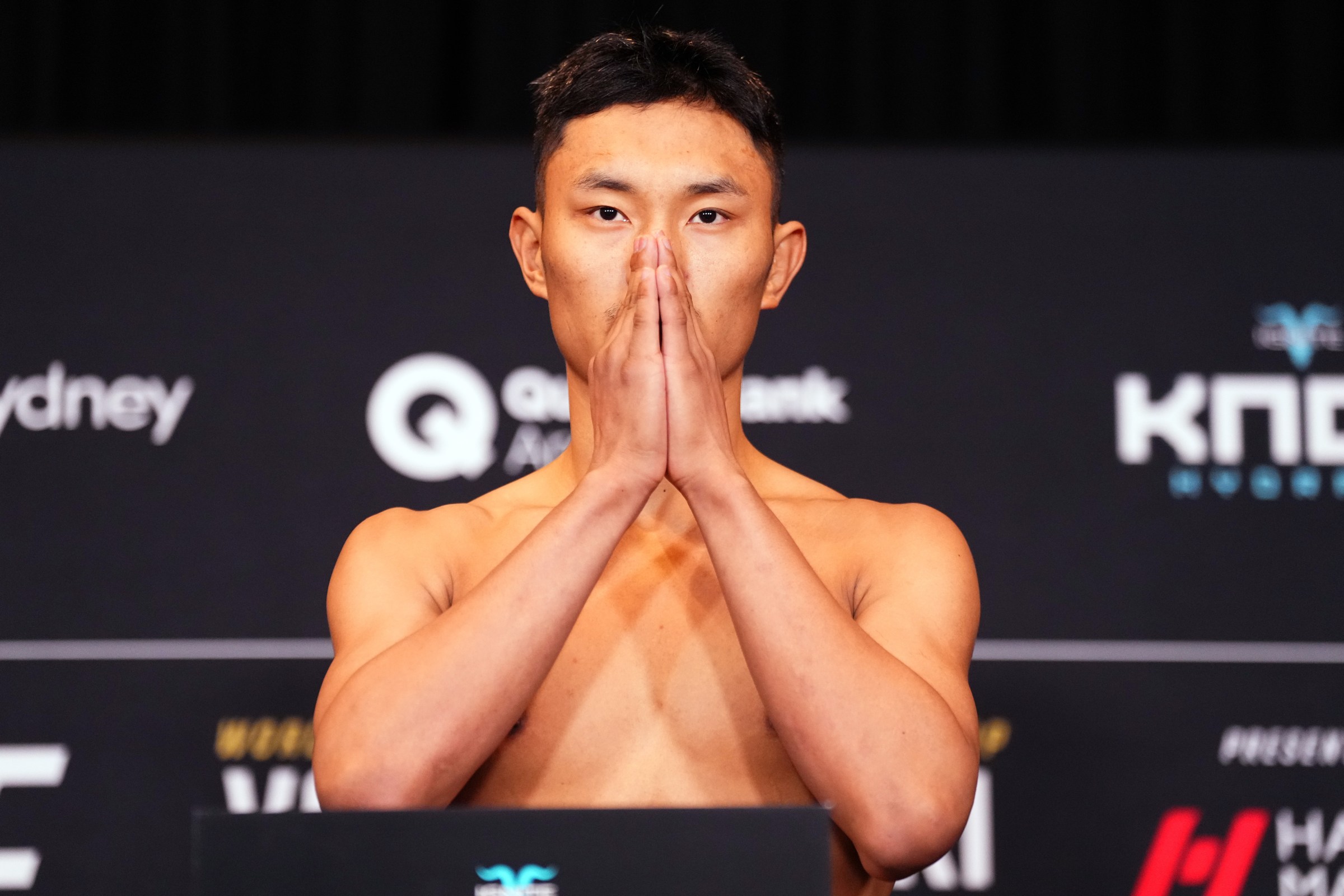 SYDNEY, AUSTRALIA - JANUARY 30: Sulangrangbo of China poses on the scale during the UFC 325 official weigh-ins at Hilton Sydney on January 30, 2026 in Sydney, Australia. (Photo by Jeff Bottari/Zuffa LLC)