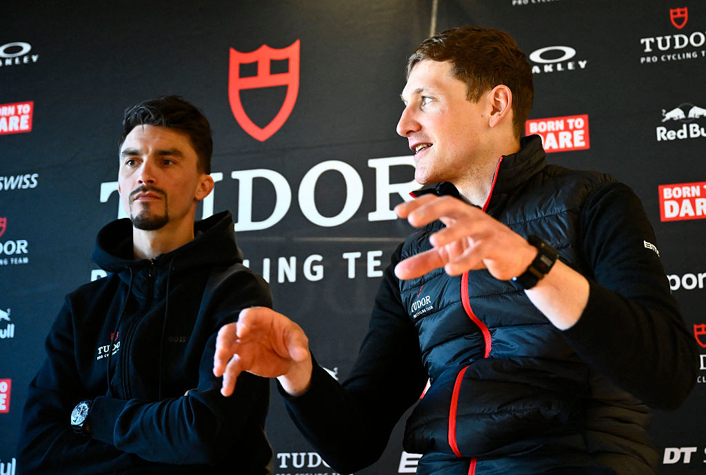 Tudor Pro Cycling Team's French cyclist Julian Alaphilippe (L) and Tudor Pro Cycling Team's Swiss cyclist Stefan Kung hold a press conference during the presentation of the team in Moraira, near Alicante, on January 7, 2026. (Photo by Jose Jordan / AFP)