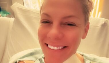 Pink marks the New Year in hospital with bandaged neck