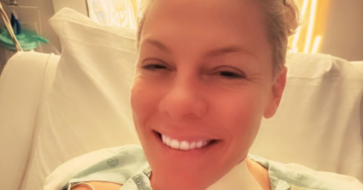 Pink marks the New Year in hospital with bandaged neck