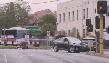 Man charged after allegedly stolen car crashes into school bus and drives at police