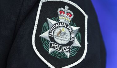 Man charged with possession of child abuse material after being intercepted at Sydney Airport