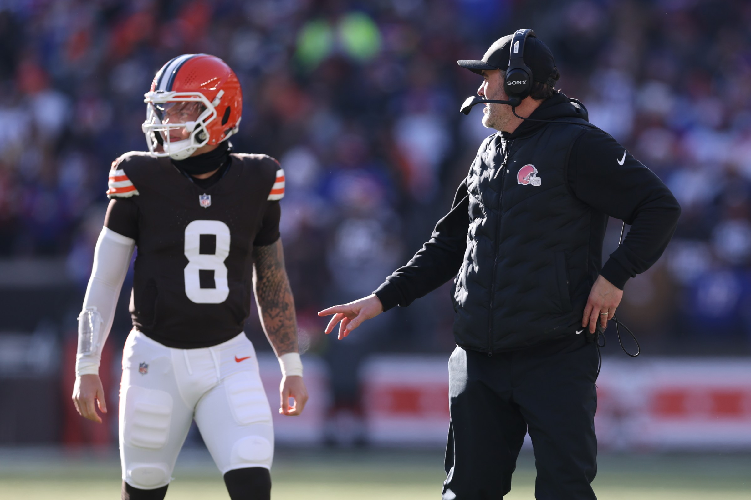 Dec 21, 2025; Cleveland, Ohio, USA; Cleveland Browns head coach Kevin Stefanski talks with quarterback Dillon Gabriel (8) before he enters the game against the Buffalo Bills during the first half at Huntington Bank Field. Mandatory Credit: Scott Galvin-Imagn Images