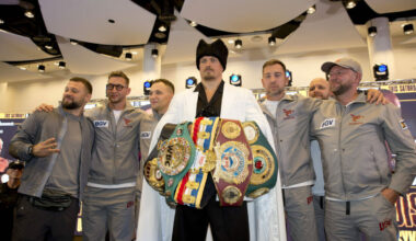 Oleksandr Usyk holding belts