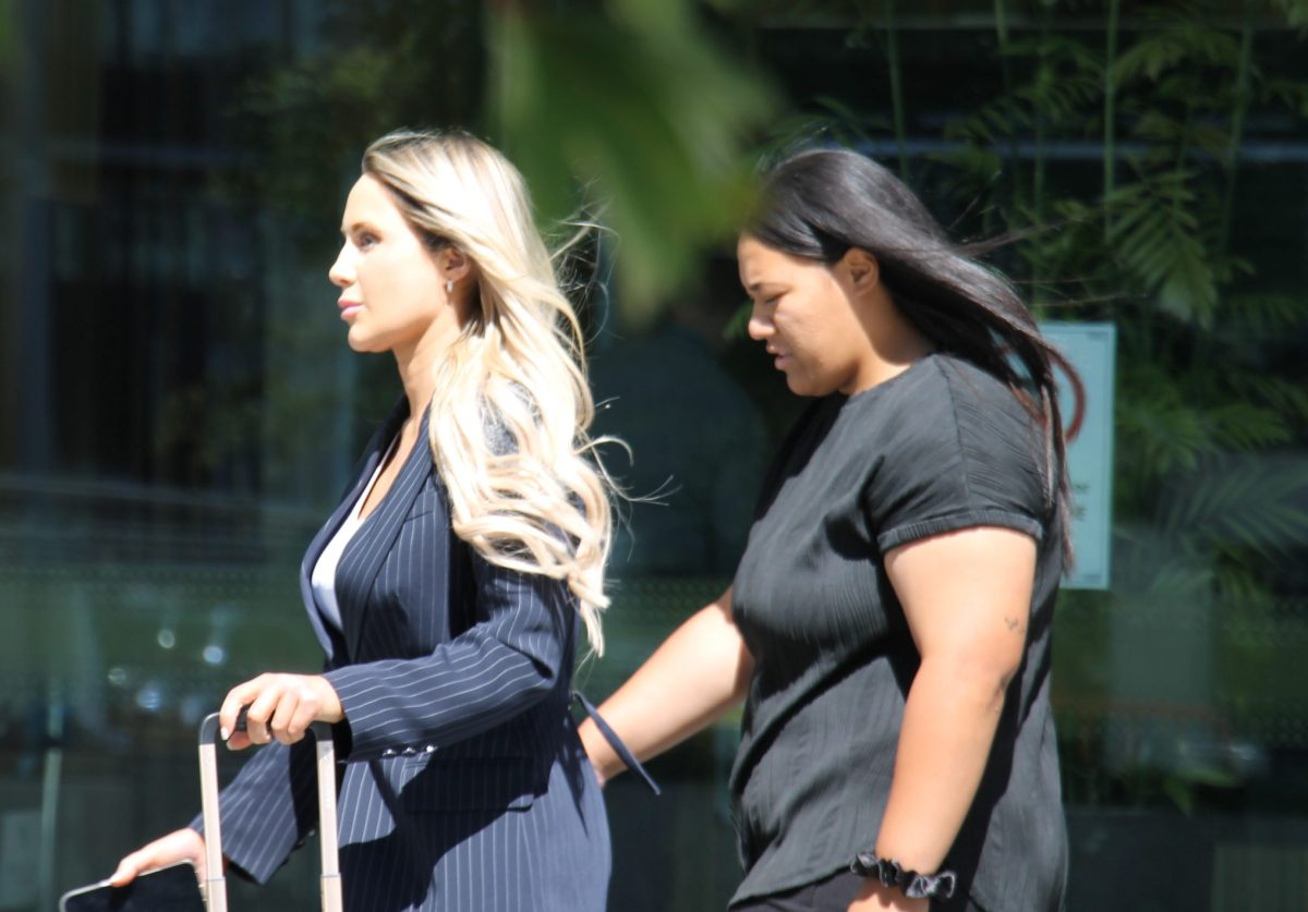 two women leaving court