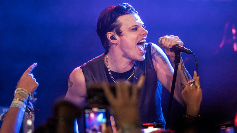 Yungblud singing on stage in 2025