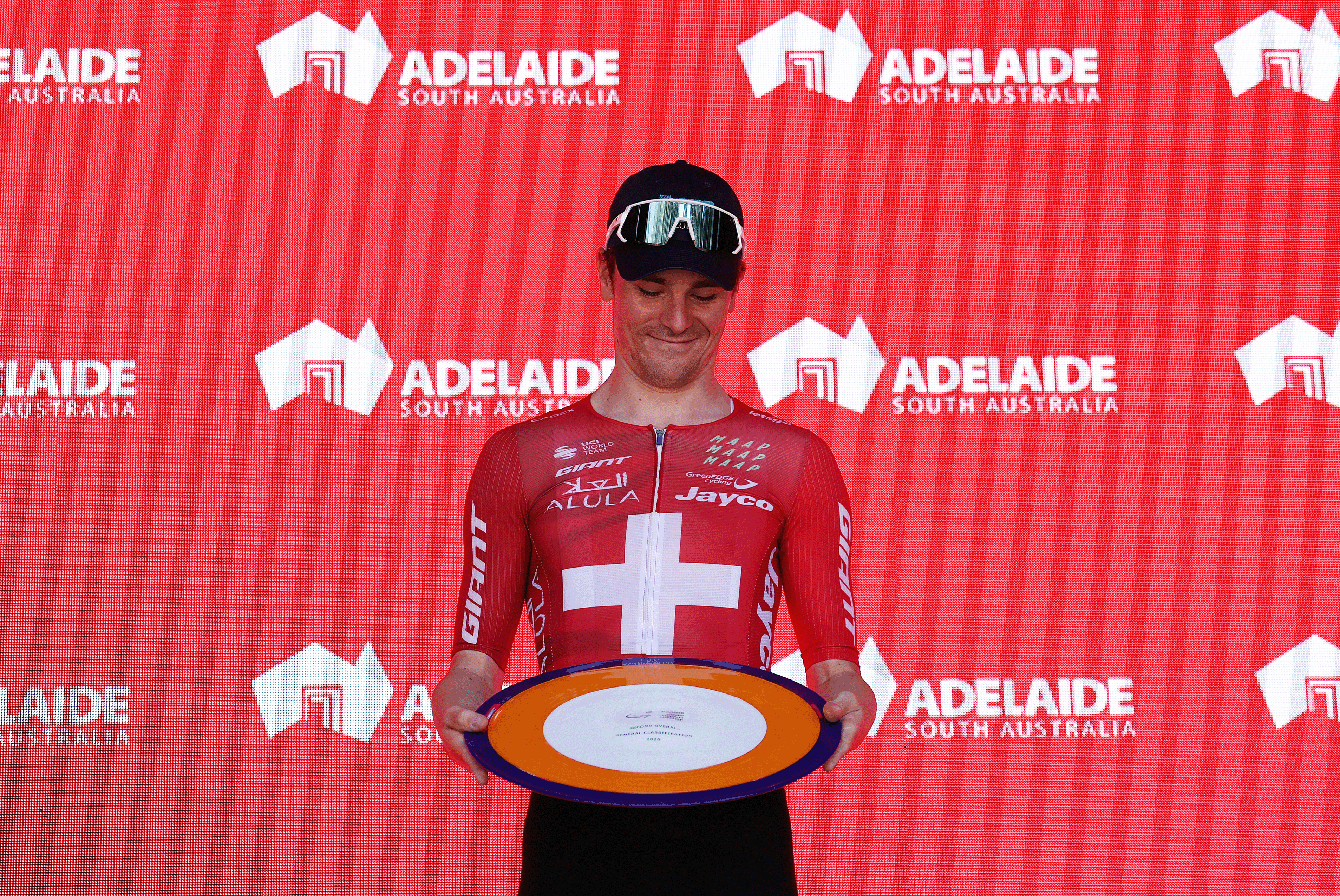 STIRLING, AUSTRALIA - JANUARY 25: Mauro Schmid of Switzerland and Team Jayco AlUla on second place poses on the podium ceremony after the 26th Santos Tour Down Under 2026, Stage 5 a 169.8km stage from Stirling to Stirling / #UCIWT / on January 25, 2026 in Stirling, Australia. (Photo by Con Chronis/Getty Images)