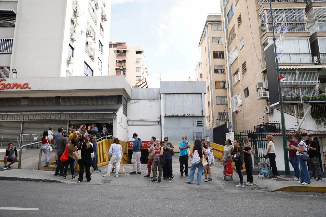 A long line of people outside a building.