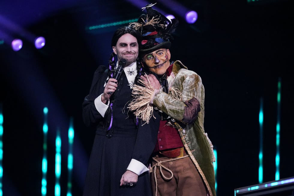 two characters on stage in a performance