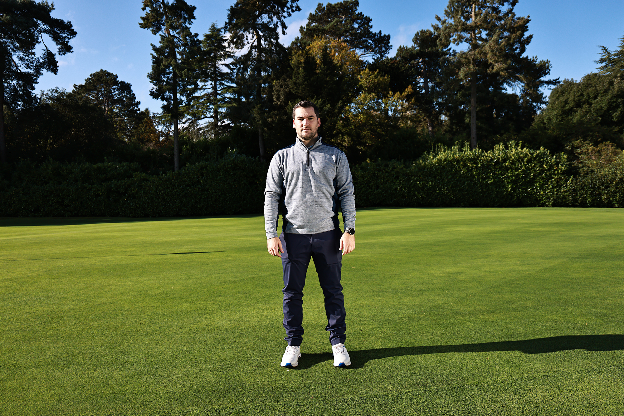 Sam De'ath wearing traditional golf attire inkeeping with the game's dress code