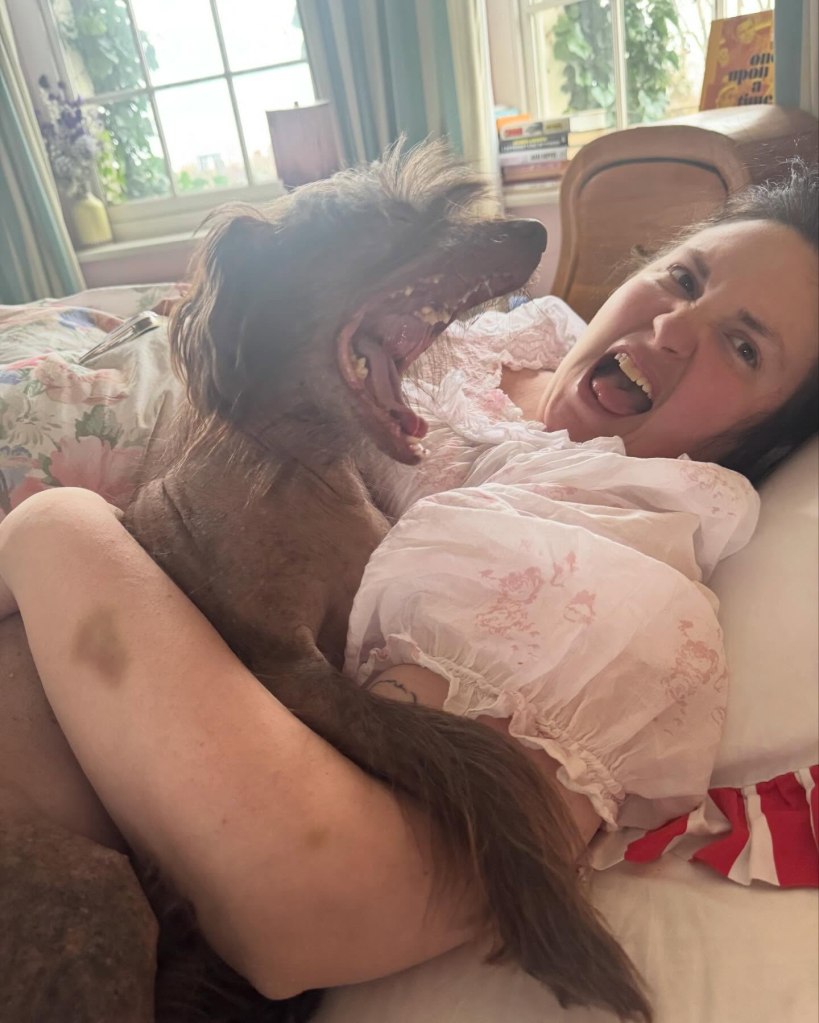 Lena Dunham gets silly with her pup.