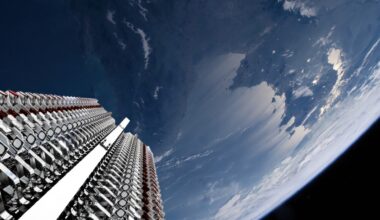 rows of metallic objects are folded up in a rack high above earth