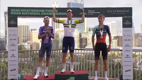 Patrick Eddy stands atop the podium after winning the Australian road race title