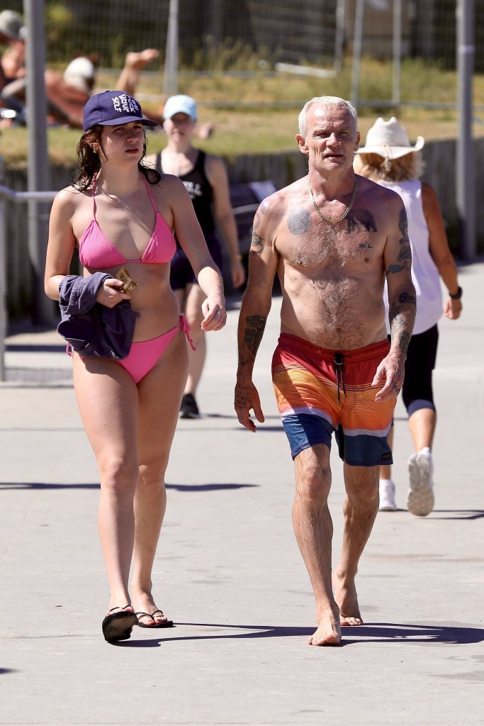 Red Hot Chili Pepper's bassist Flea enjoys a beach day with his daughter in Sydney, Australia.