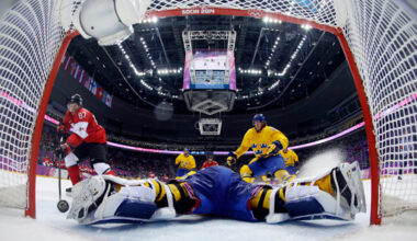 FILE - Canada forward Sidney Crosby, left, scores a goal past Sweden goaltender Henrik Lundqvist during the second period of the men