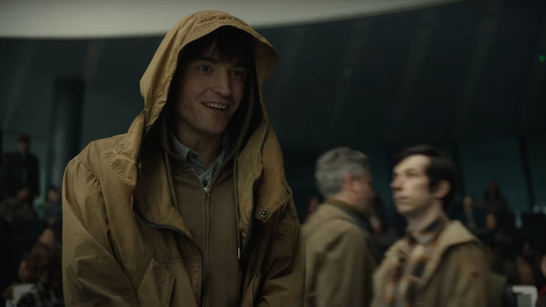 Robert Pattinson as one of the Mickeys in Mickey 17, smiling