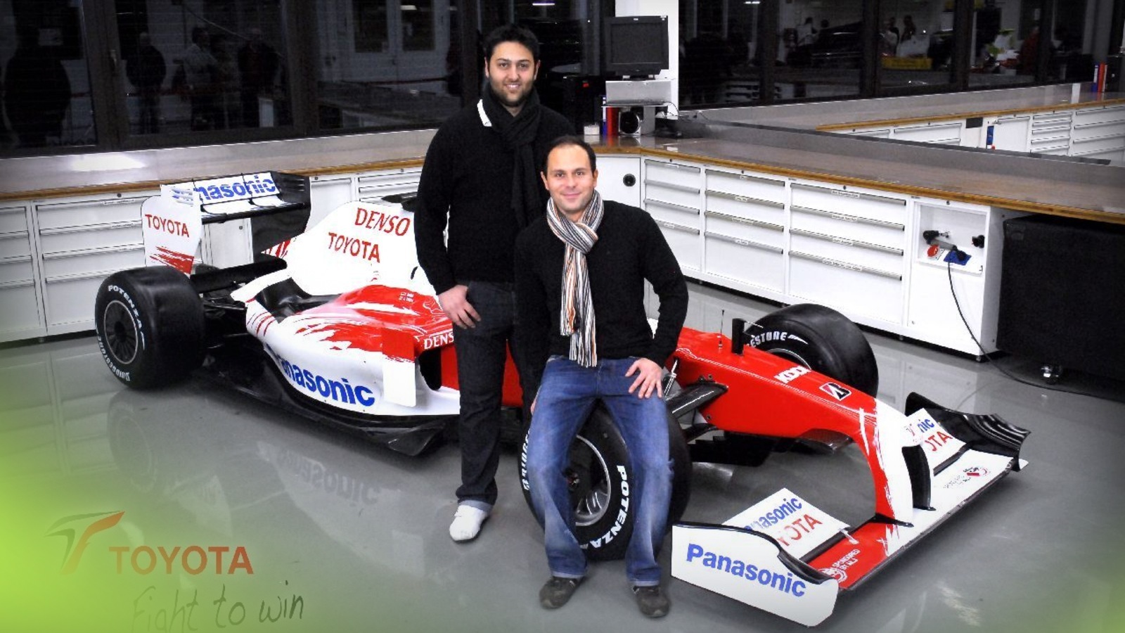 Dr Sammy Diasinos (standing) with the Toyota TF109.