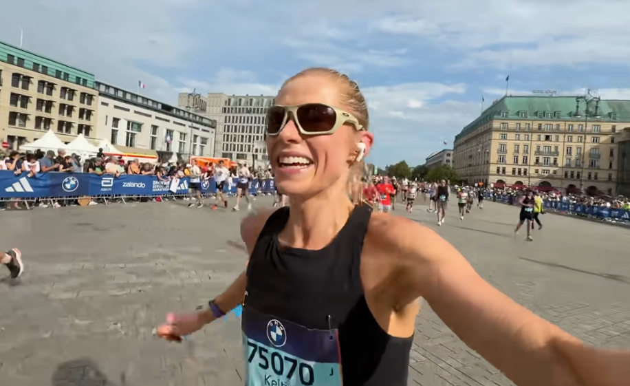 runner celebrating at a marathon finish line