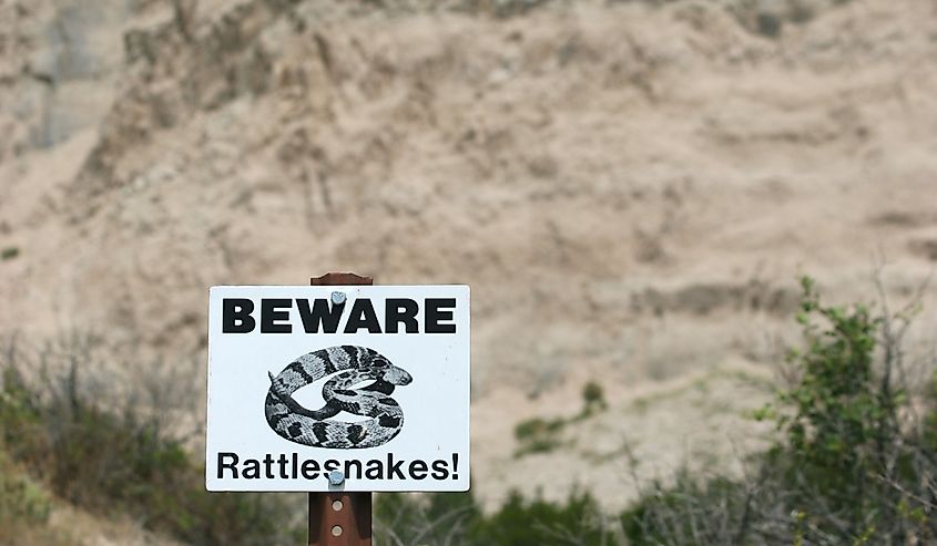 Beware of rattlesnakes sign in Badlands National Park