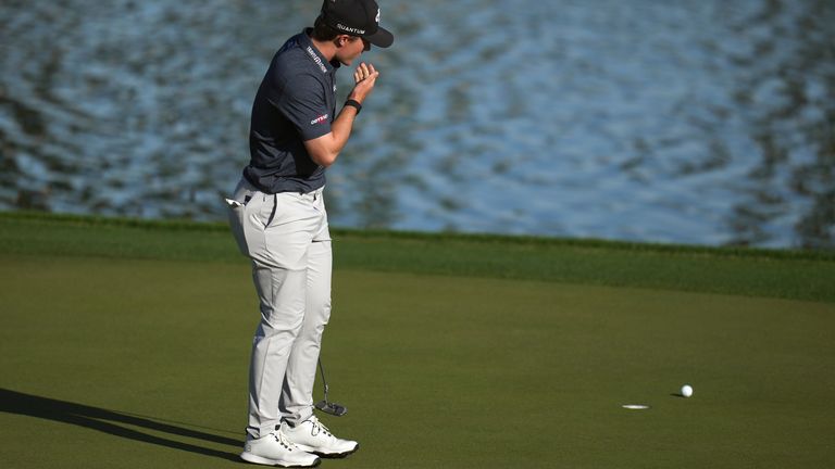Blades Brown reacts to missing a birdie putt at the ninth hole, his final hole, scoring a 12-under-par 60 during the second round of the American Express golf event at the Jack Nicklaus Tournament Course at PGA West Friday, Jan. 23, 2026, in La Quinta, Calif. (AP Photo/Ross D. Franklin)