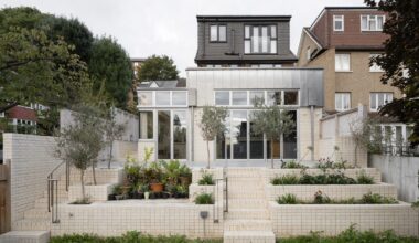 Zinc and white brick rear facade of Tabberner Cook House by James Alder Architects