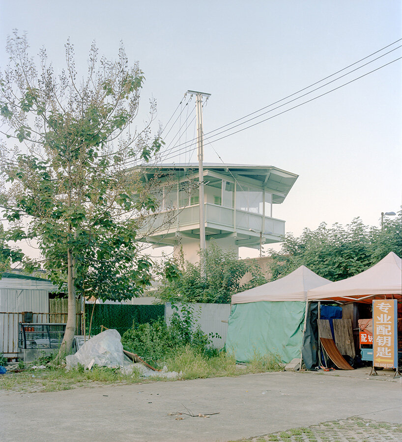 tiny 24-hour bookstore by SZ-architects crowns former prison watchtower in china