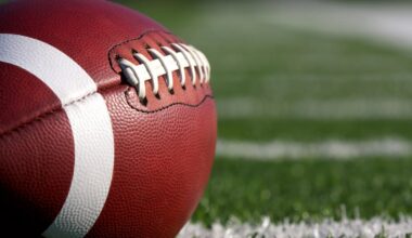 Close-up of a football sitting on grass.