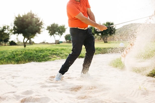 My opponent dug his feet in a bunker, then got another club and did it again. Isn't that building a stance? – Australian Golf Digest