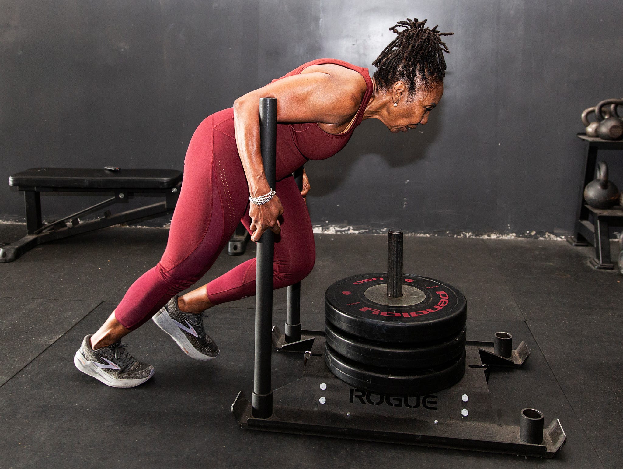 cynthia sanders pushes a weighed sled during a workout at dtx performance co in dallas\, texas\, on june 6\, 2025.
