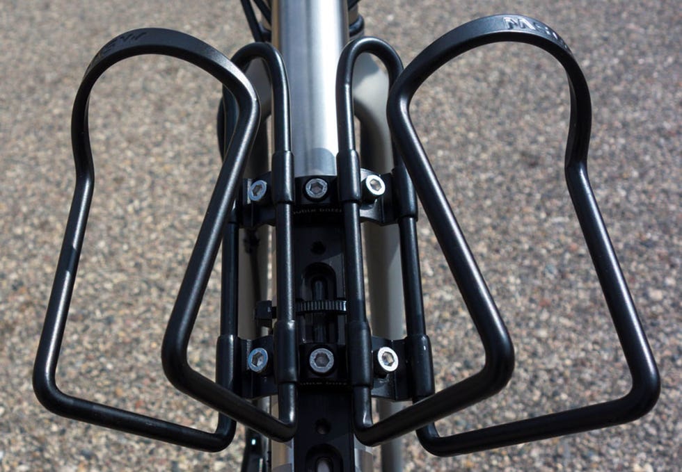 bicycle frame with a black bottle cage attached to it