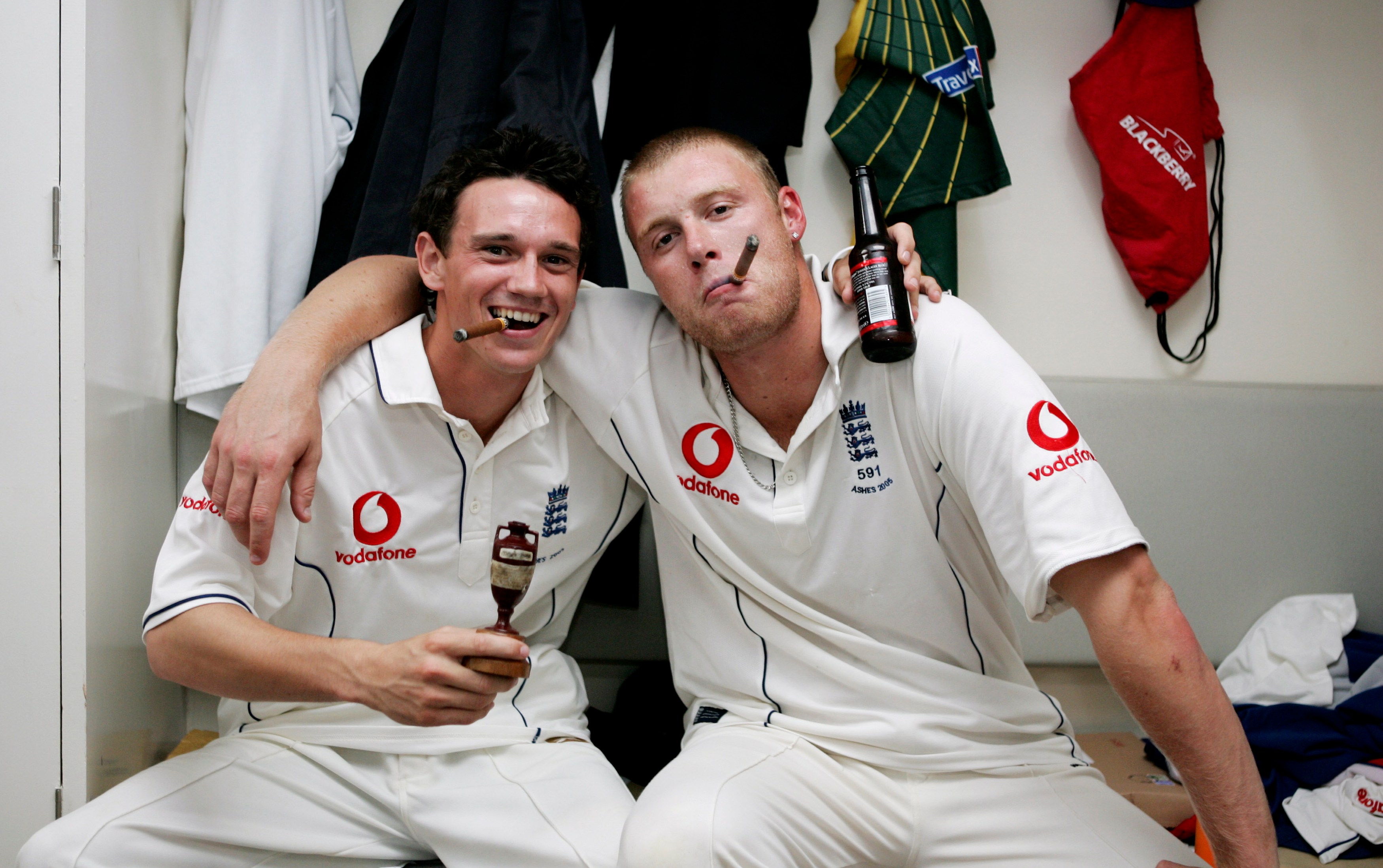 Gary Pratt and Andrew Flintoff celebrating England's Ashes victory with cigars, beer, and the Ashes urn.