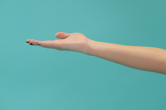 A person's forearm and hand with palm facing up.