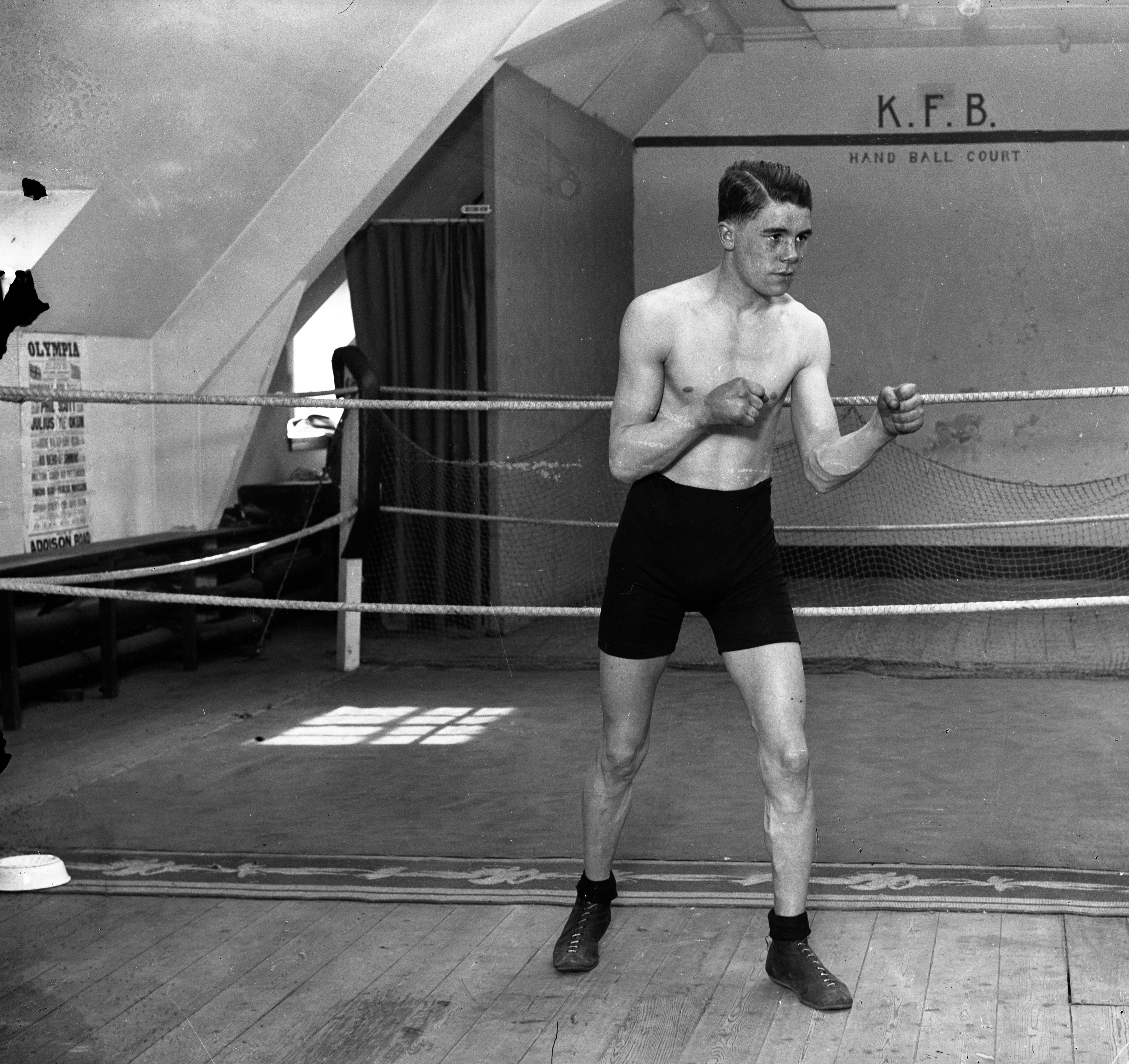 Boxer Teddy Baldock standing in a boxing ring.