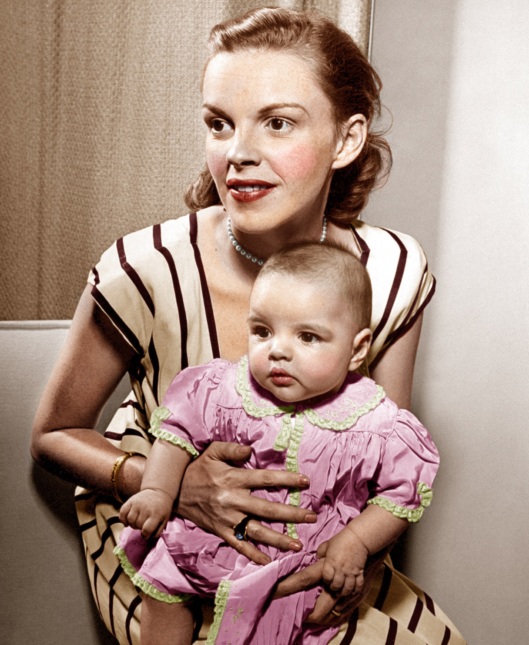 Judy Garland holds baby daughter, Liza Minnelli, 1946