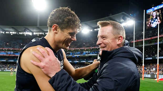 Michael Voss and Charlie Curnow in 2023.