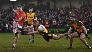 22 February 2026; Oisín Conaty of Armagh shoots under pressure from Eoghan Bán Gallagher of Donegal during the Allianz Football League Division 1 match between Armagh and Donegal at BOX-IT Athletic Grounds in Armagh. Photo by Ramsey Cardy/Sportsfile